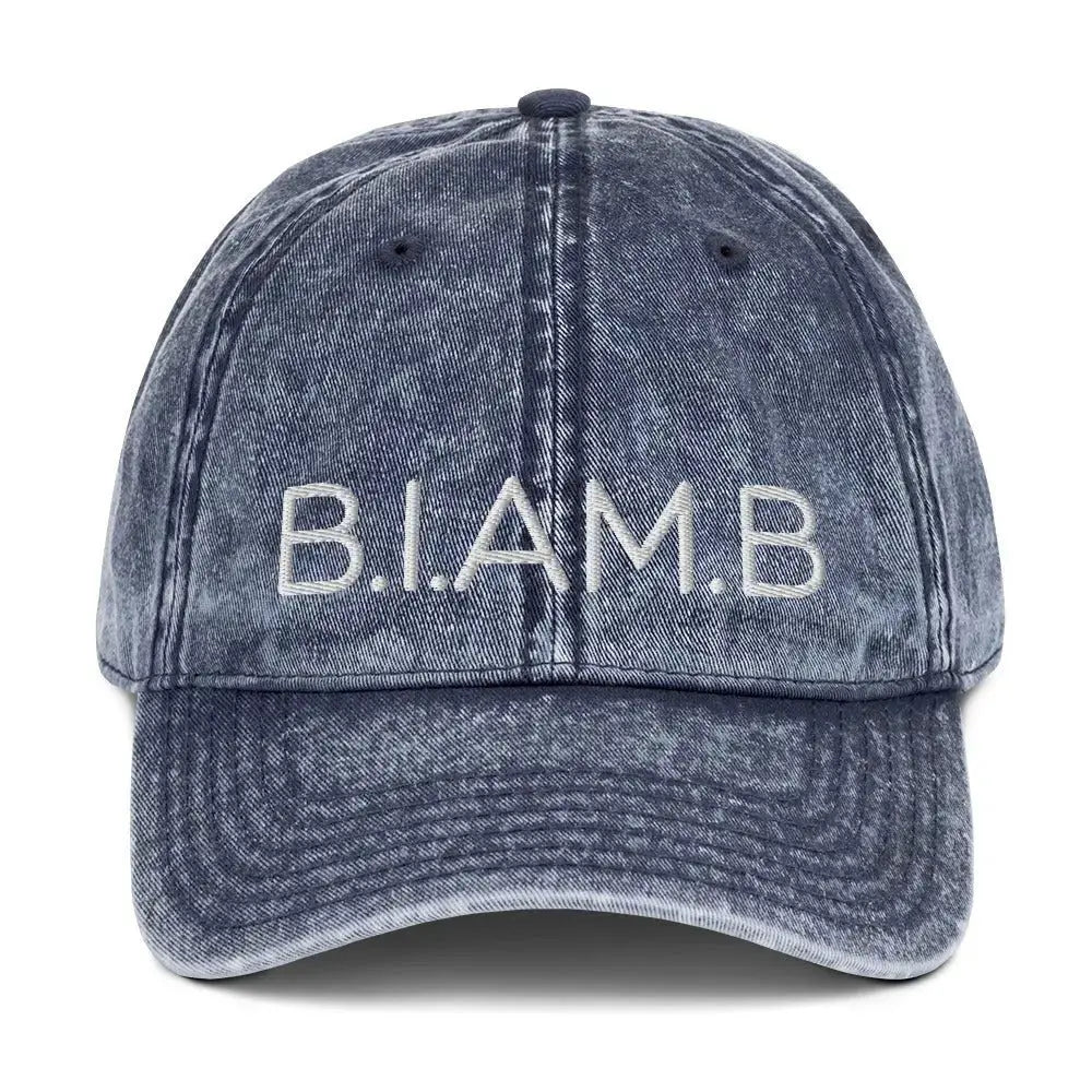 Front view of B.I.AM.B “Wear Your Power” embroidered dad hat in washed blue
