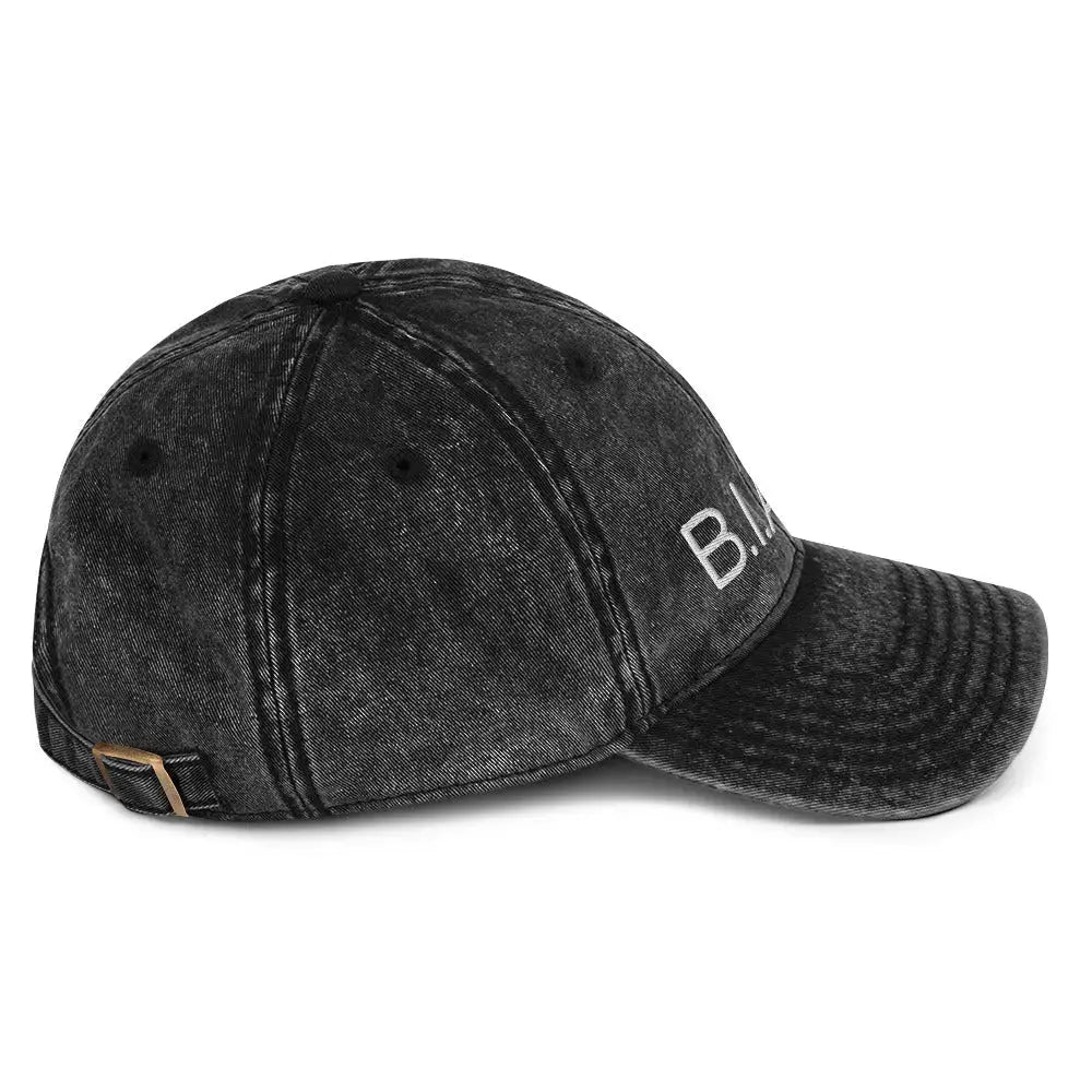 Right side view of B.I.AM.B Wear Your Power edition black dad hat highlighting side profile and curved brim